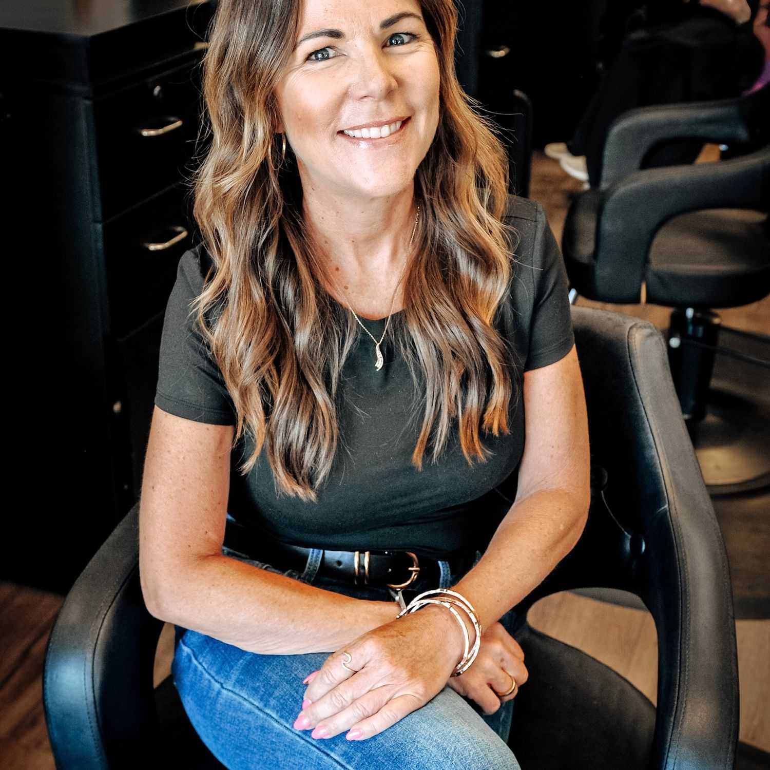 Portrait of Amy, a professional stylist at D & S Styling, showcasing their expertise and style.