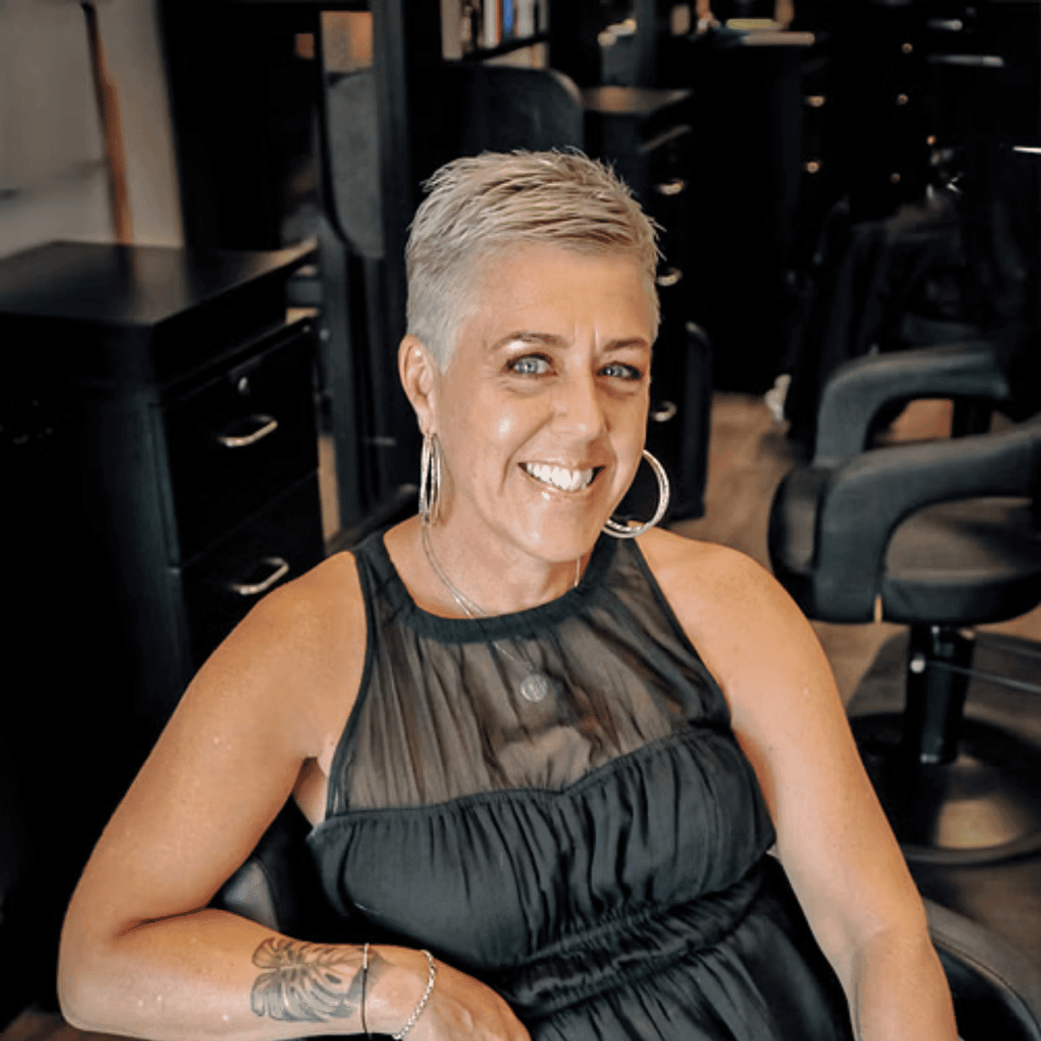 Portrait of Erin, a professional stylist at D & S Styling, showcasing their expertise and style.