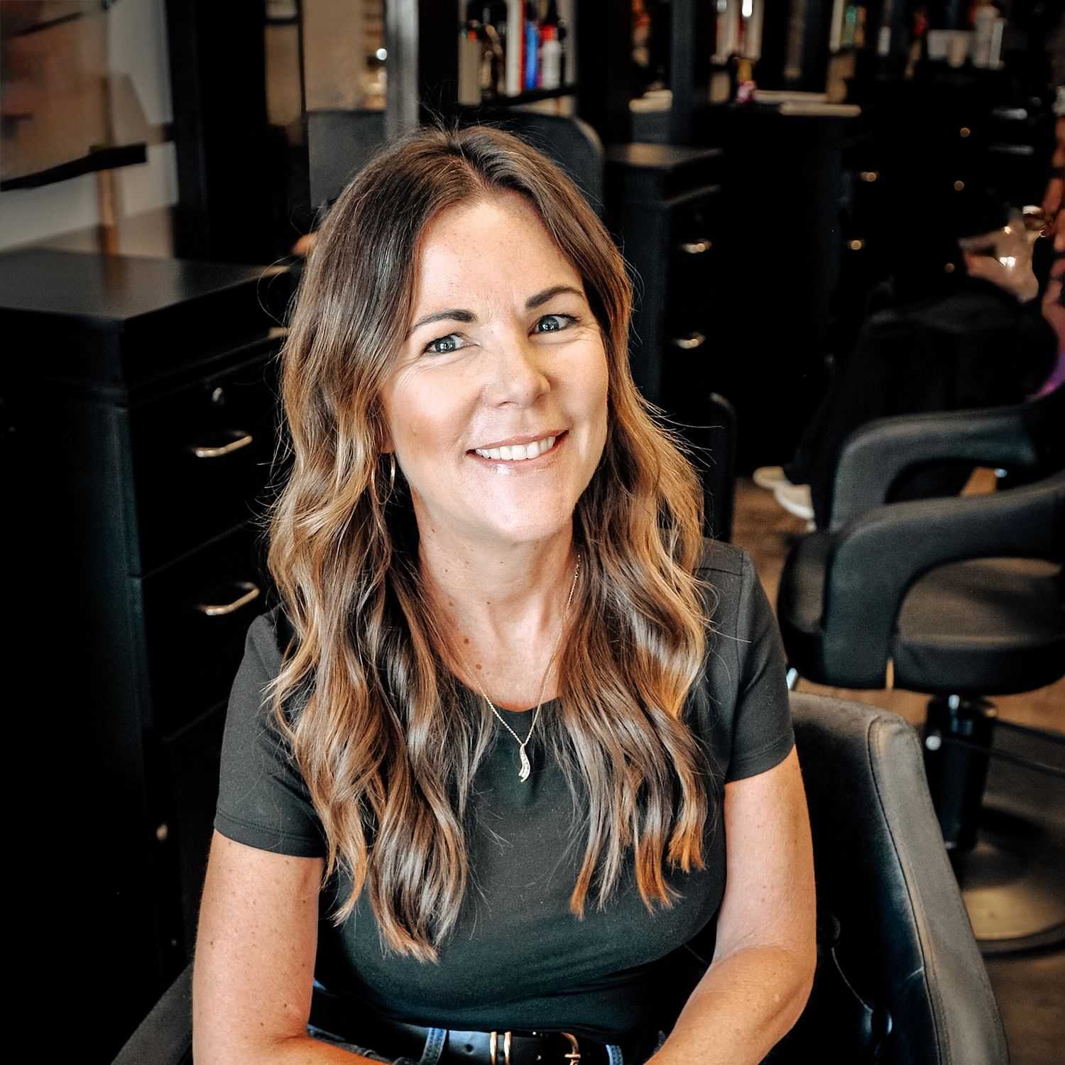 Portrait of Amy, a professional stylist at D & S Styling, showcasing their expertise and style.