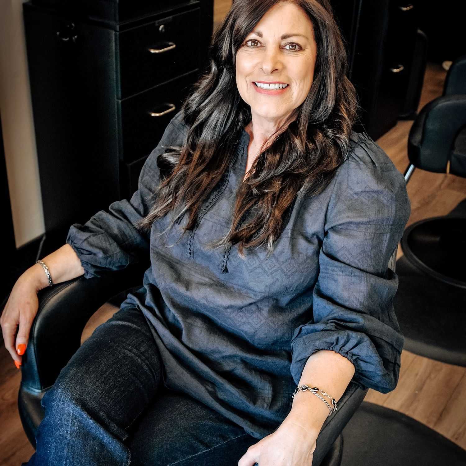 Portrait of Diane, a professional stylist at D & S Styling, showcasing their expertise and style.