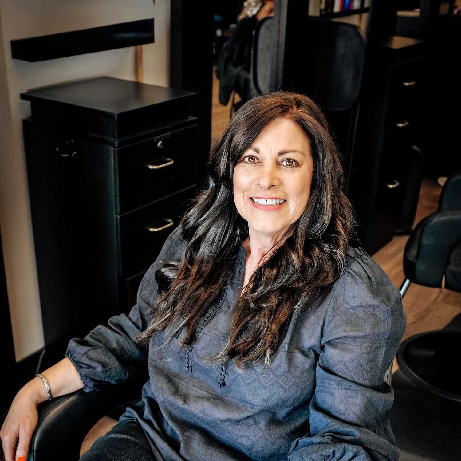 Portrait of Diane, a professional stylist at D & S Styling, showcasing their expertise and style.