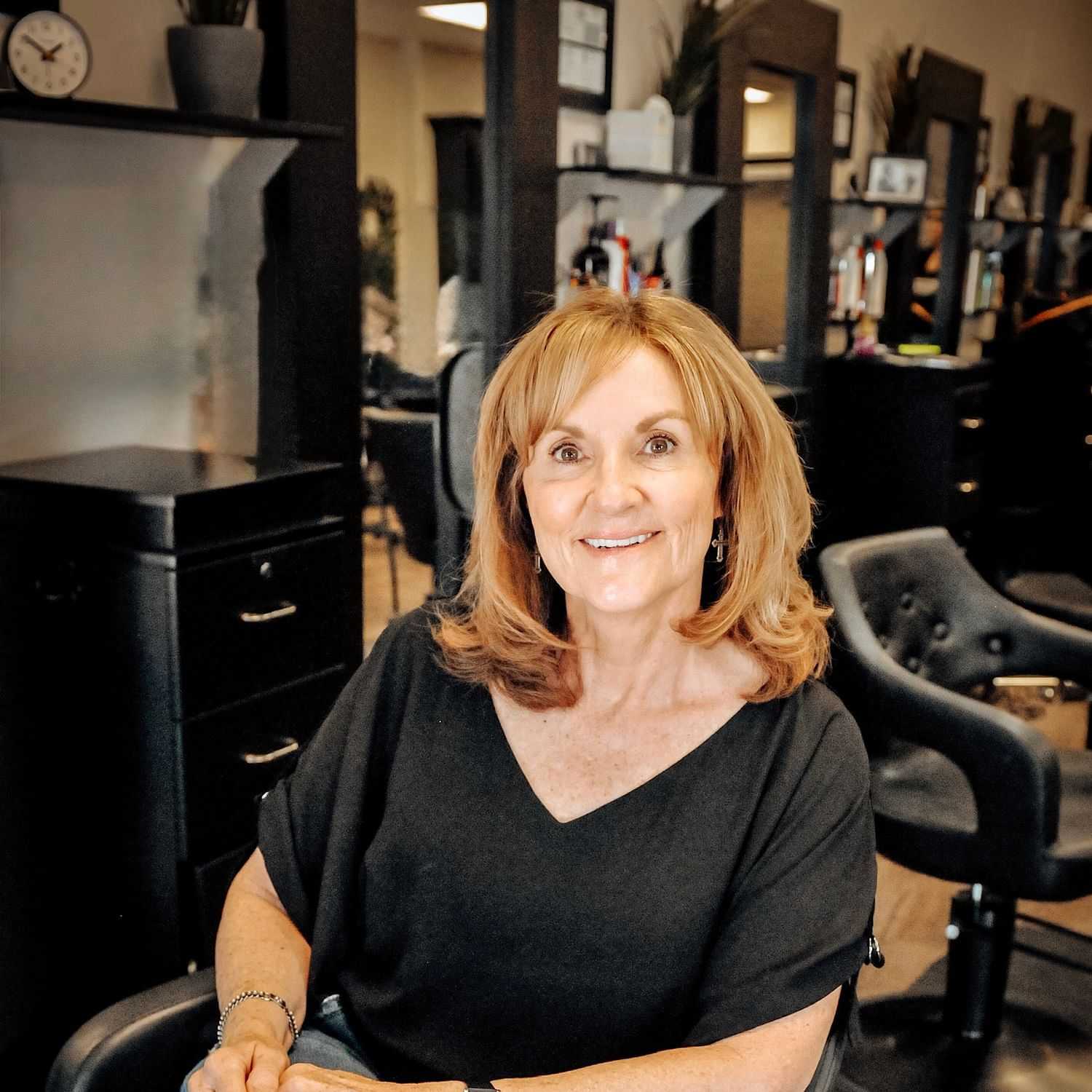 Portrait of Liz, a professional stylist at D & S Styling, showcasing their expertise and style.