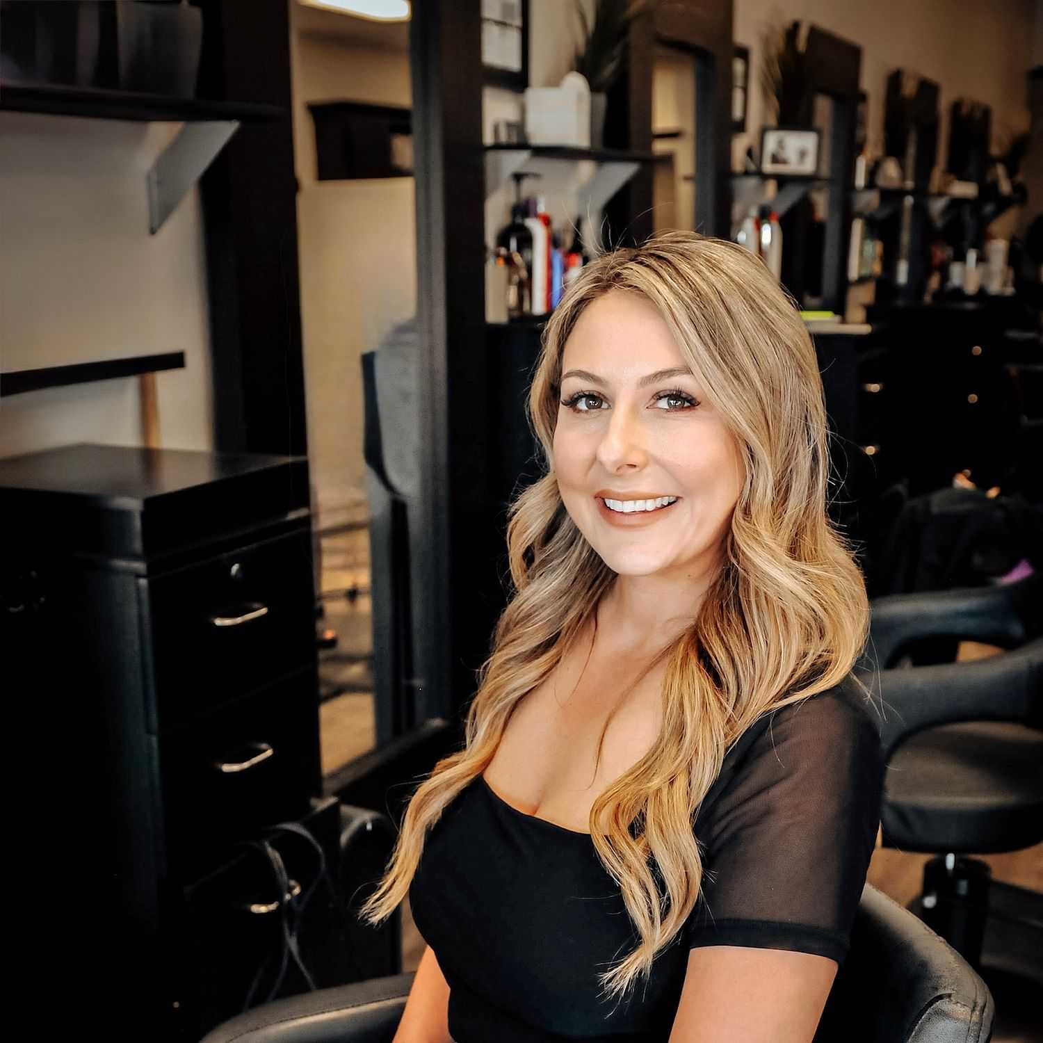 Portrait of Paige, a professional stylist at D & S Styling, showcasing their expertise and style.